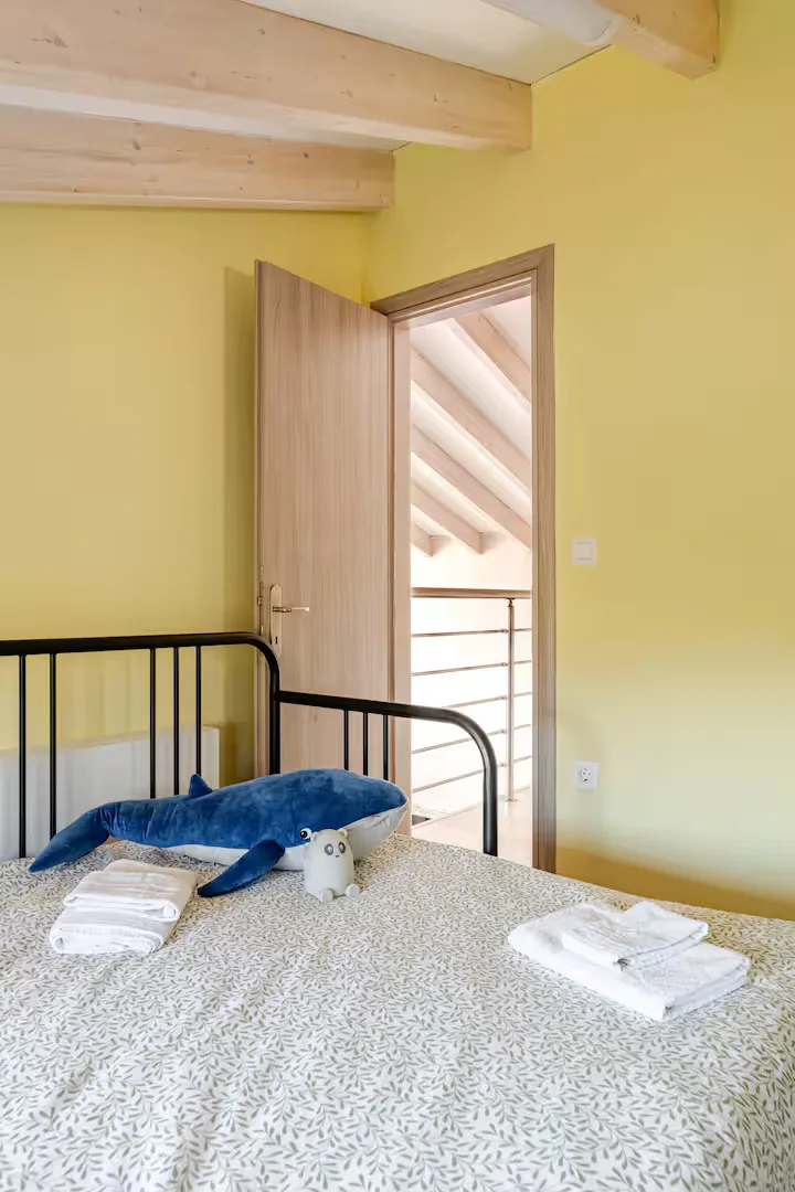 Calm, neutral twin room with crisp white linens
