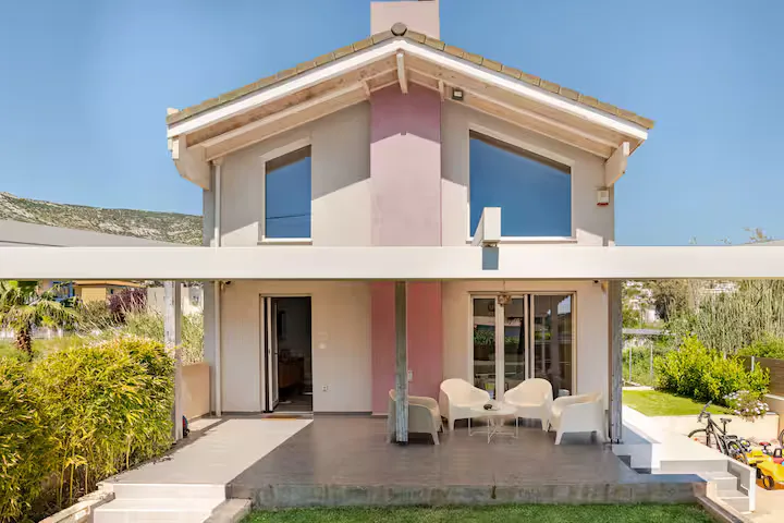 Welcome to GS-Vibes Villa — your coral-pink retreat on the Porto Rafti coast